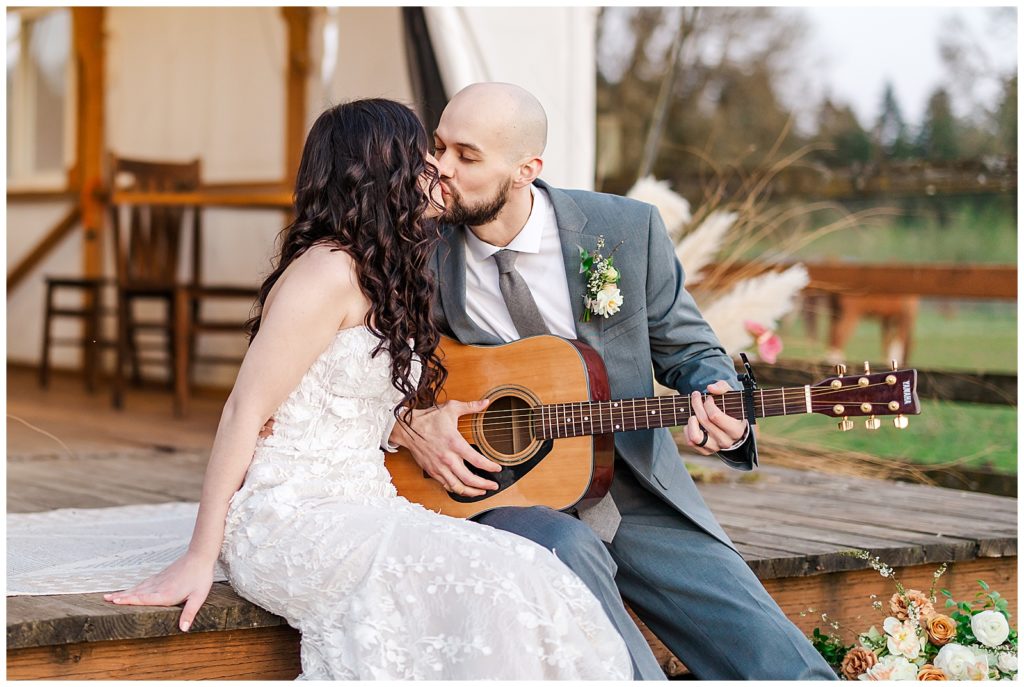 Five Oaks Farm Wedding bride and groom playing guitar