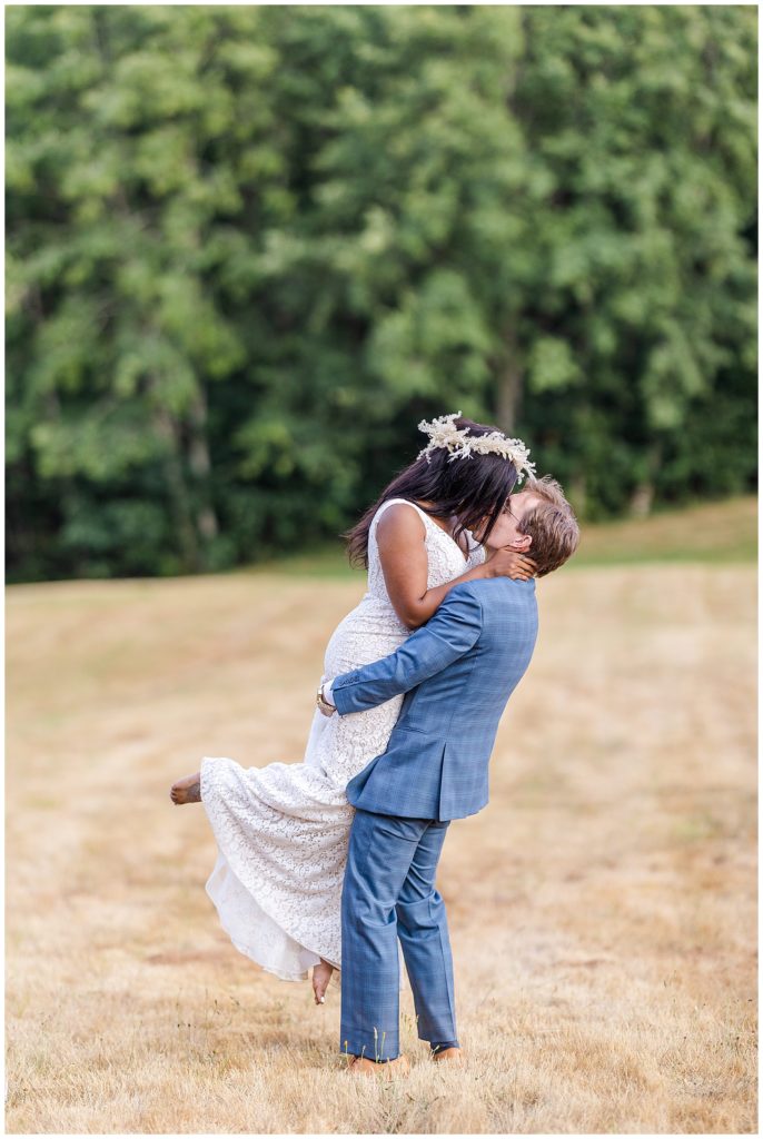 Hornings Hideout wedding groom lifting bride kiss