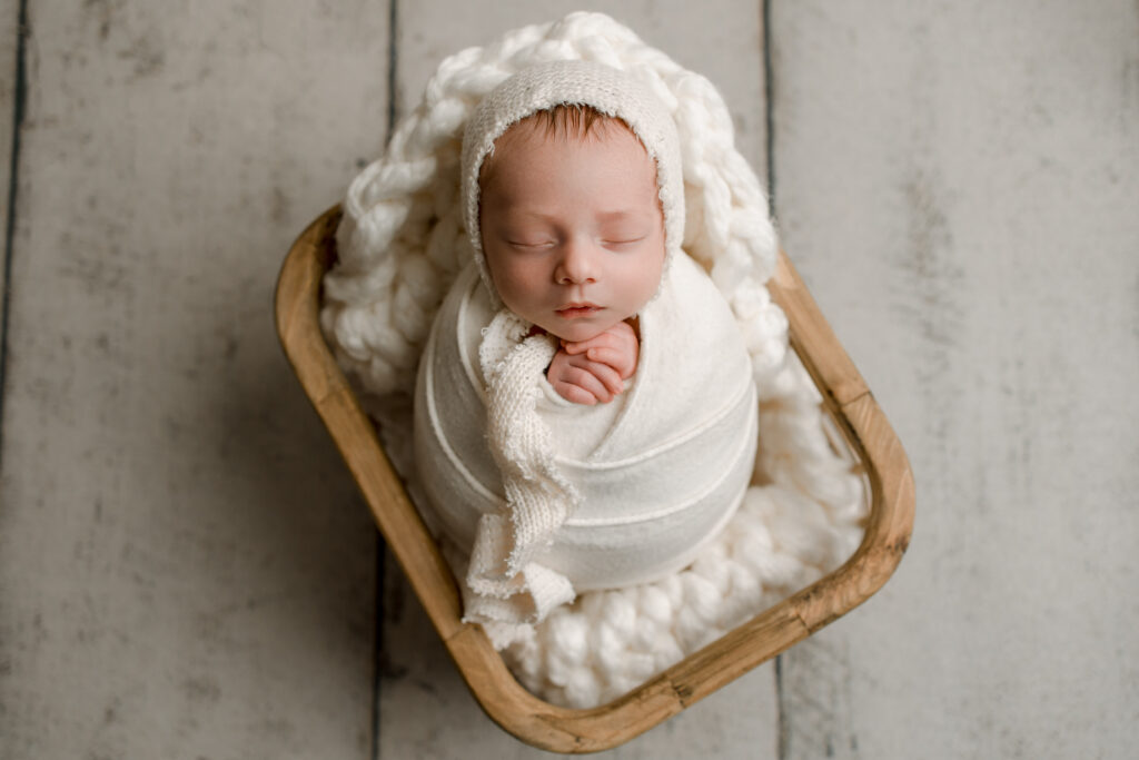 Follow these newborn photography session tips to snag priceless images like this one.